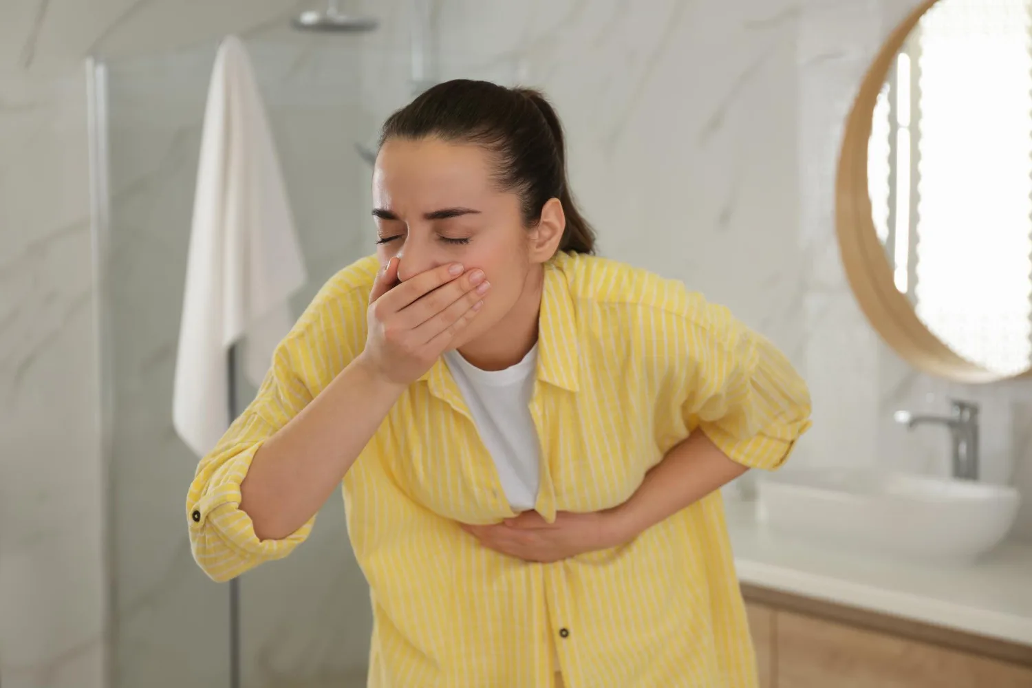 Person experiencing digestive discomfort commonly linked to semaglutide sulfur burps as a side effect of GLP‑1 medications